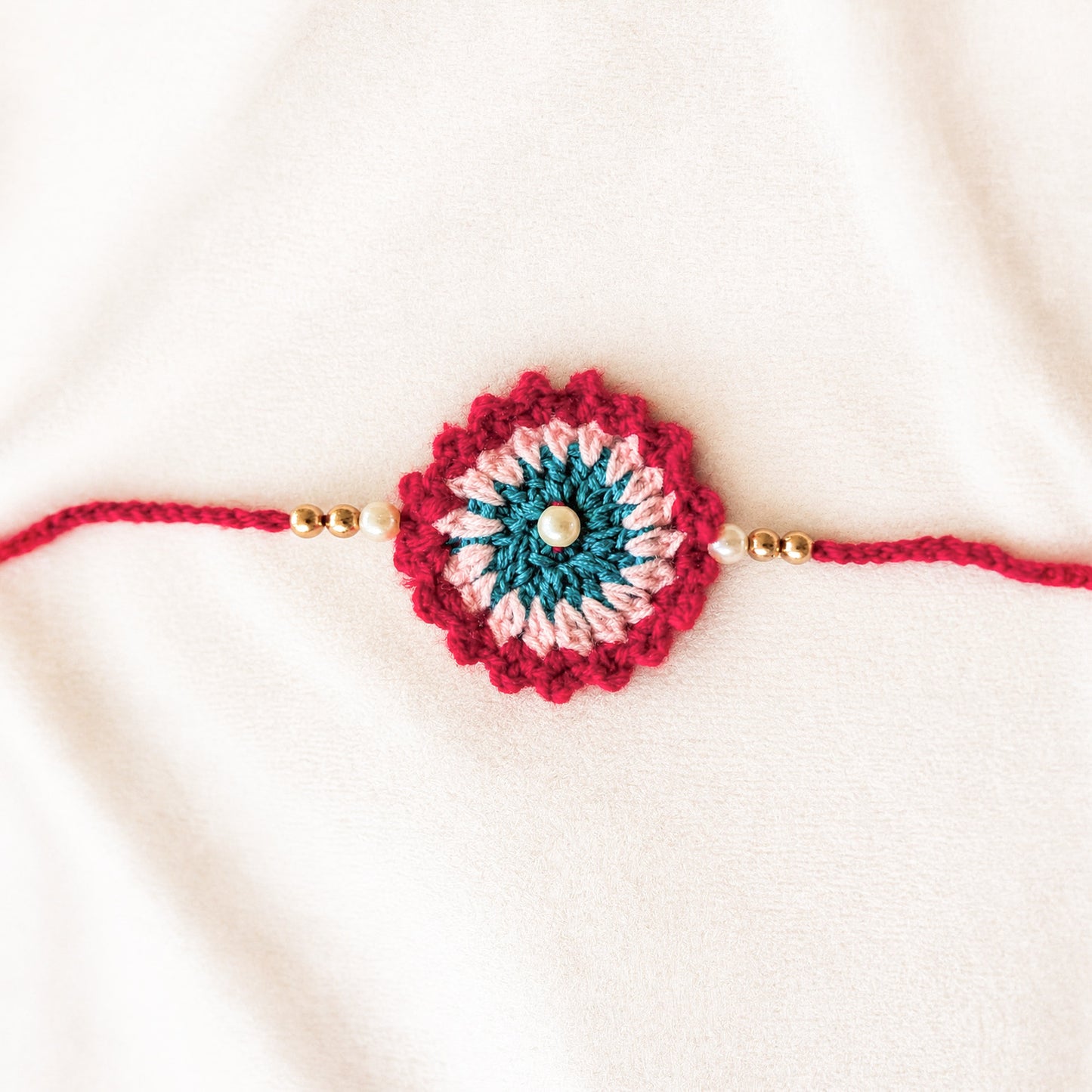 Handmade Red Crochet Rakhi with Pearl Beads | Raksha Bandhan