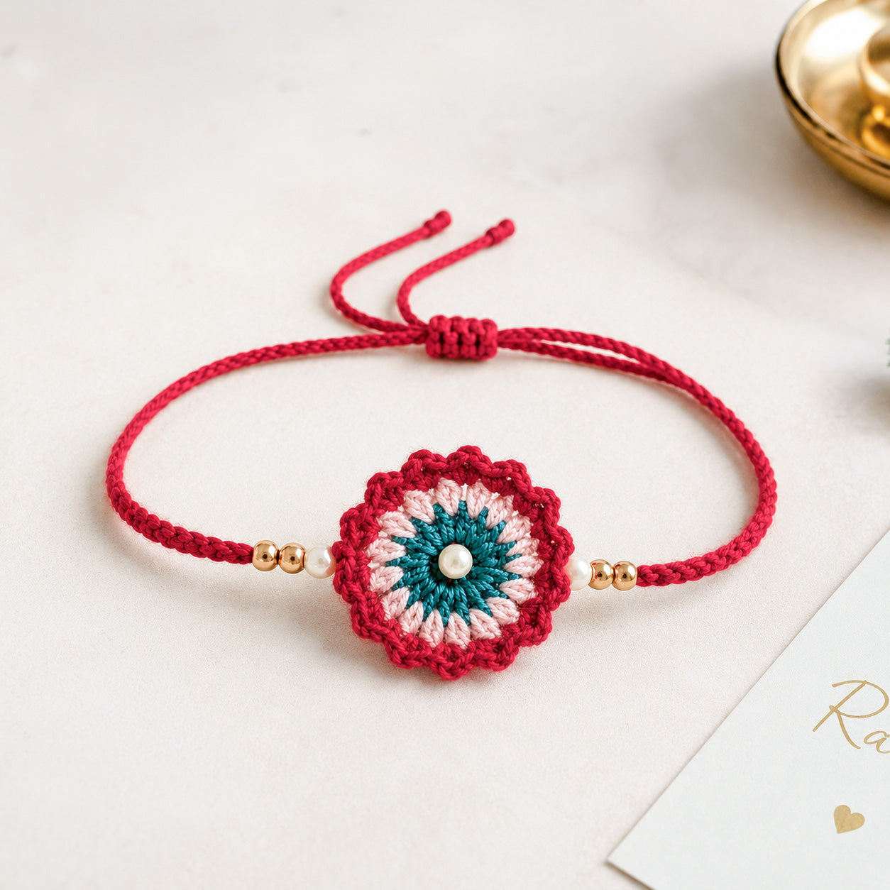 Handmade Red Crochet Rakhi with Pearl Beads | Raksha Bandhan