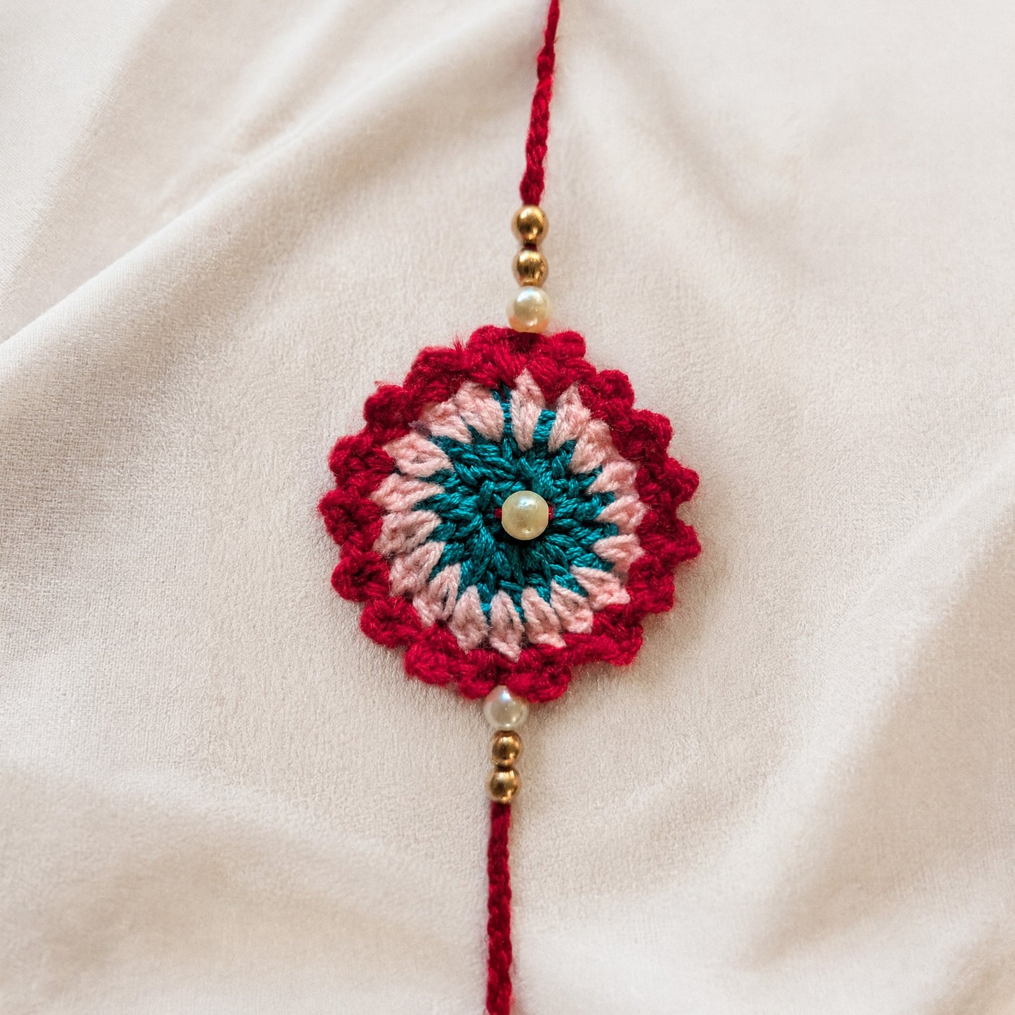 Handmade Red Crochet Rakhi with Pearl Beads | Raksha Bandhan